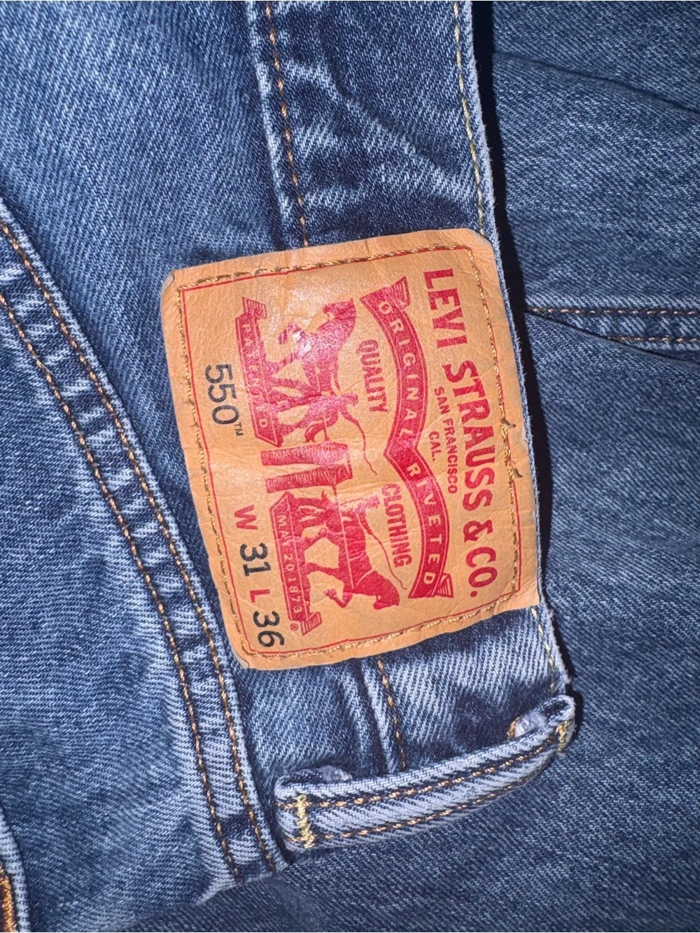Levi's 550 Relaxed Fit Jeans in Denim Blue with Leather Patch